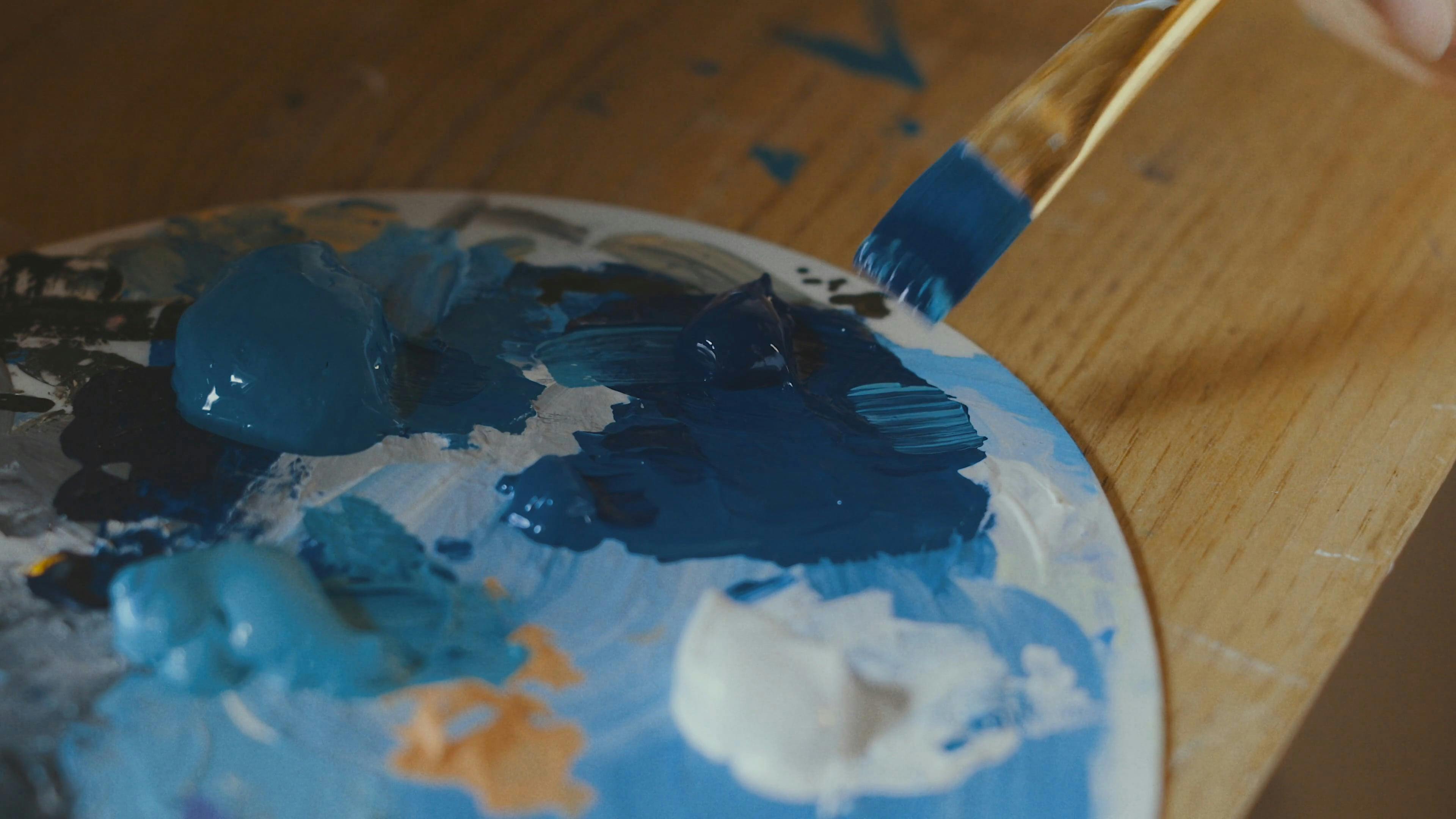 A Person Mixing Paints on the Paint Board · Free Stock Video