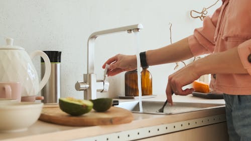 Woman Peeling the Avocado