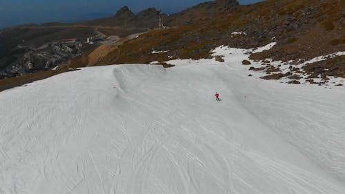 Skiing Down The Mountain Of A Ski Resort