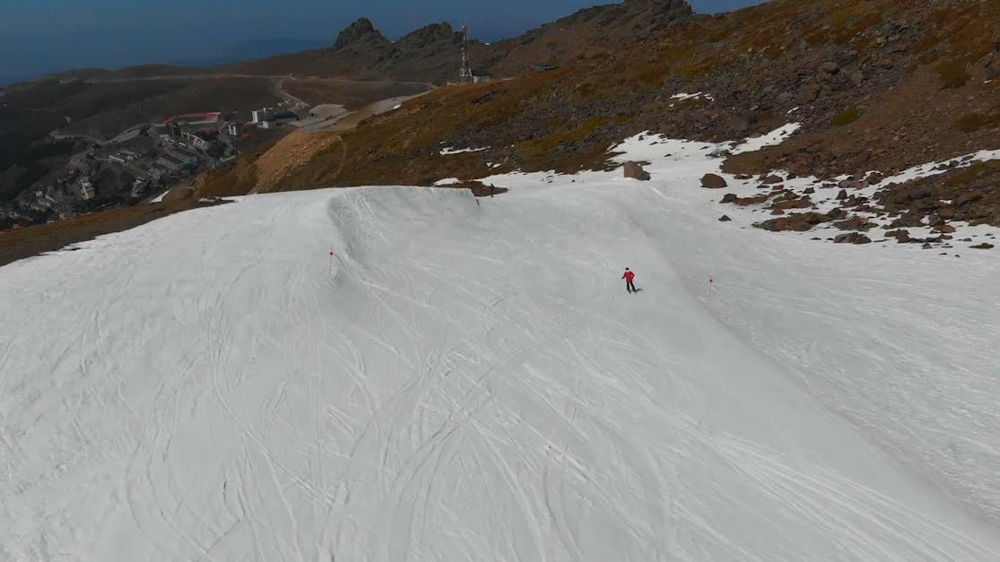 Premium Photo  Closeup of a skier sliding down the mountain on the snow at  the ski resort