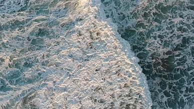 aerial footage of the water waves in the ocean