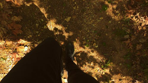 Top Angle Of A Person Feet Walking On The Ground