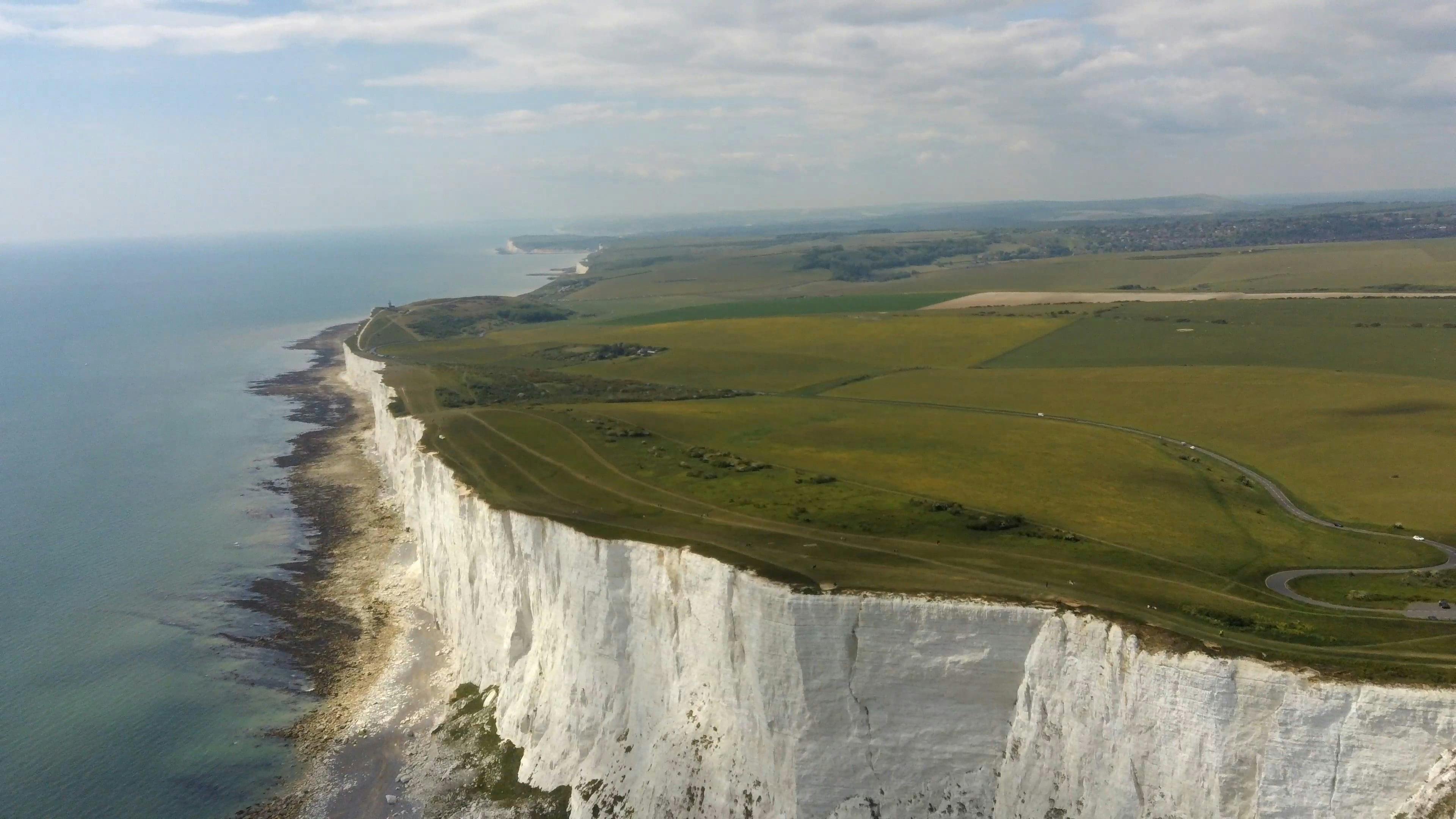 Drone Footage Of A Coastline Cliff Above The Sea · Free Stock Video