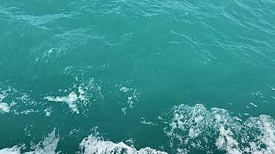 water splashing from a moving boat in the ocean
