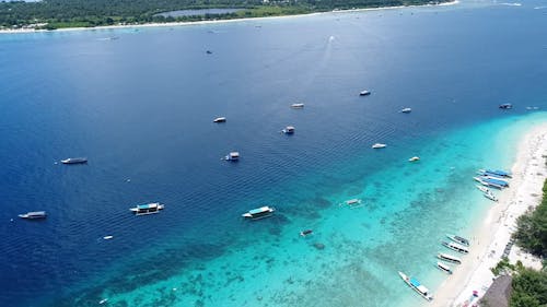 Aerial Footage of Boats In a Blue Sea