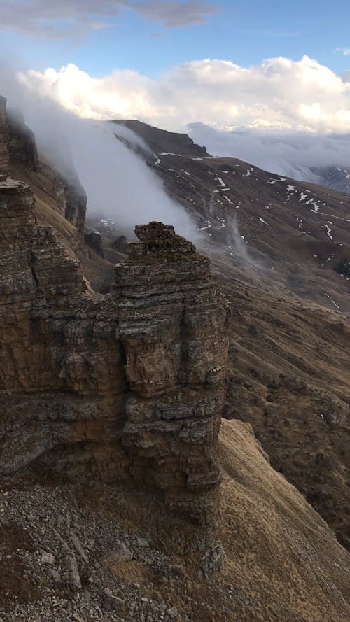 Fog on the Mountain Cliff