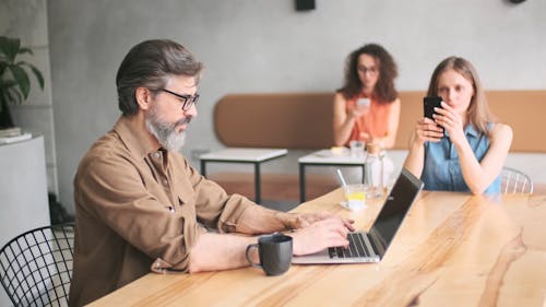 Man Typing on His Laptop