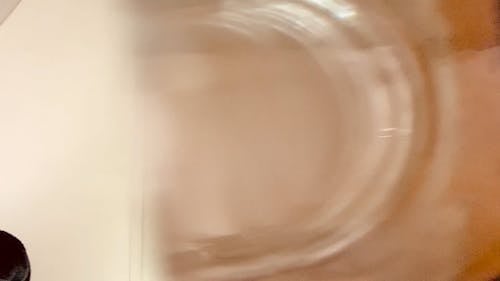 Dropping Ice Cubes on Glass of Water