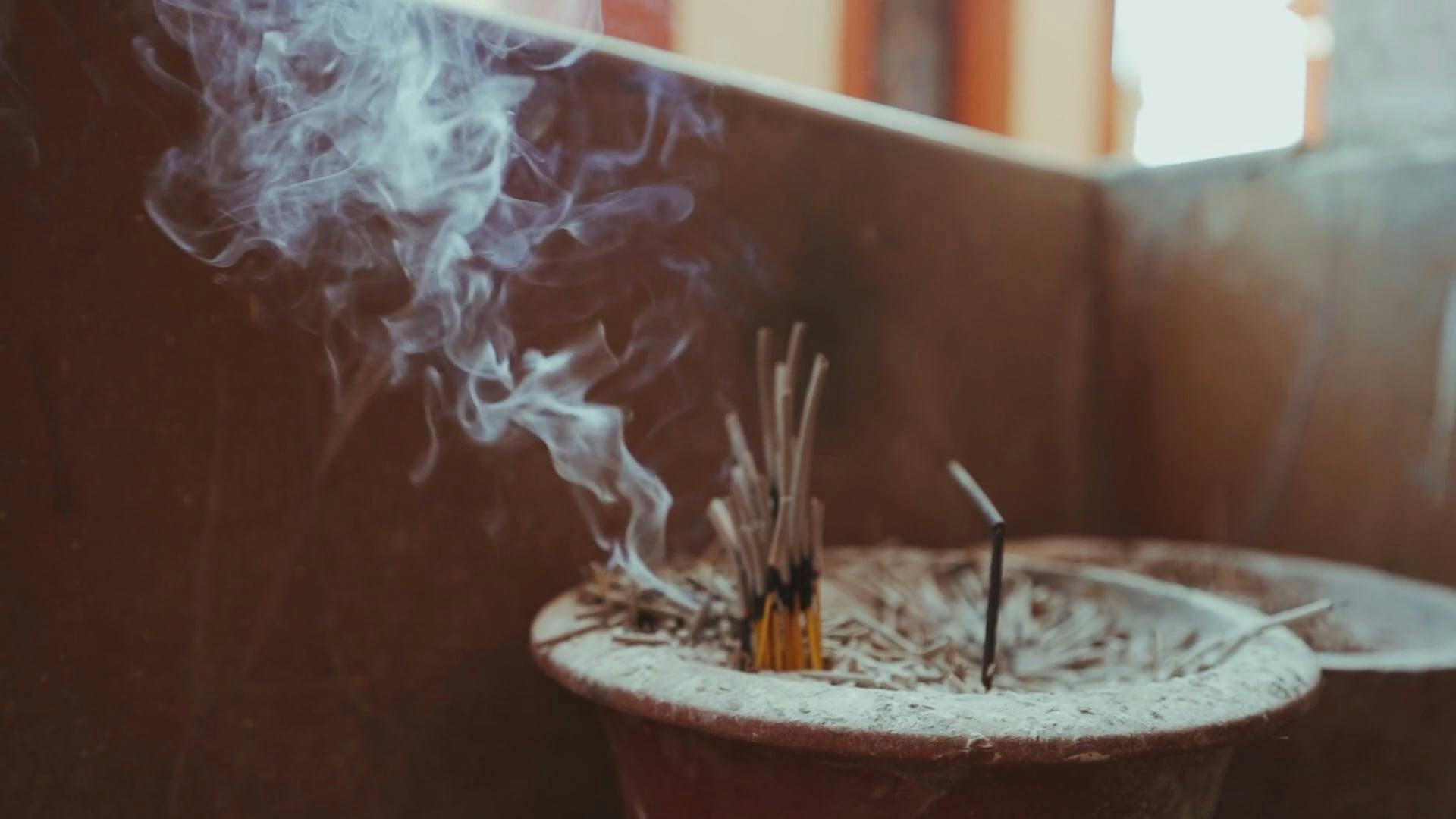 Smoke Coming From The Burning Incense Sticks · Free Stock Video