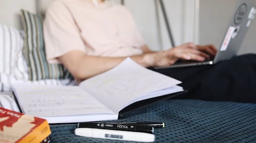 Crop Person Working On Laptop At Home