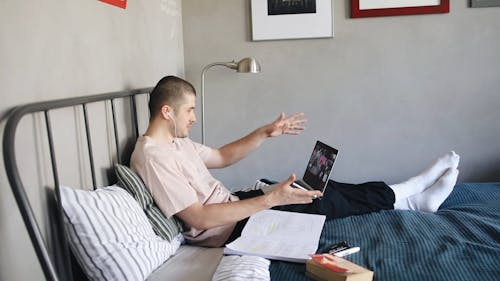 A Man Having a Video Call While Working