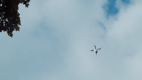 Drone Flying in Cloudy Sky