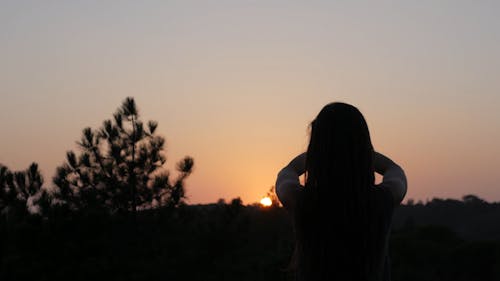 Doing Yoga at Sunset