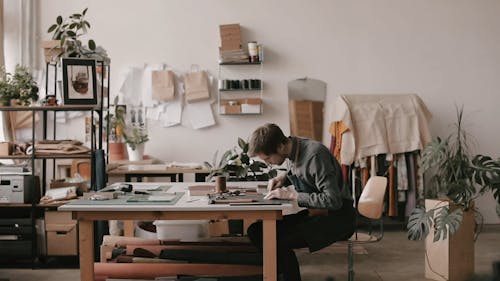 Man Cutting Brown Leather