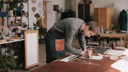Man Tracing a Leather Piece