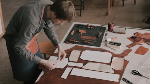 Man Assembling The Paper Piece on Leather