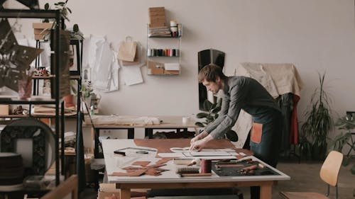 Man Assembling The Paper on the Leather