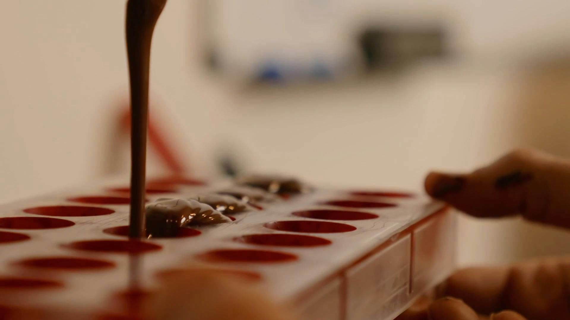 Shaping Melted Chocolates Using A Tray Mold · Free Stock Video
