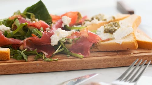 Meats and Breads on Wooden Board