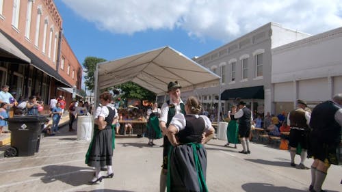 People Performing A Traditional Dance On The Street