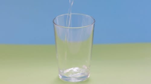 Clear Glass Being Filled With Water