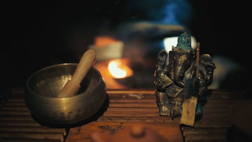 Tibetan Singing Bowl Near Ganesha Statue