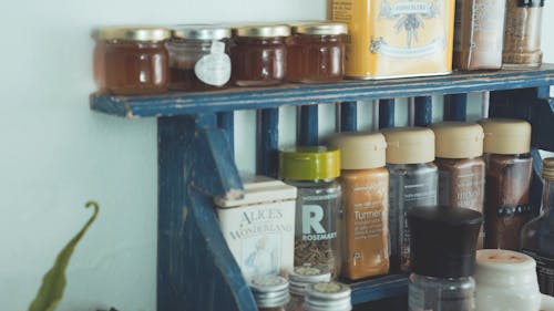 Different Kind Of  Dried Herbs And Spices On A Kitchen Rack