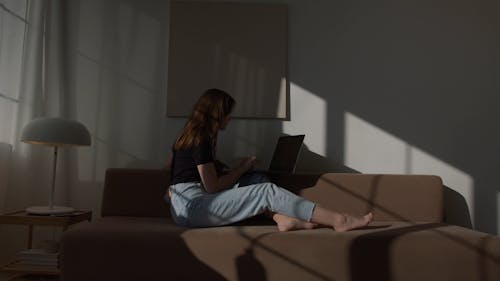 Woman Working On Laptop At Home