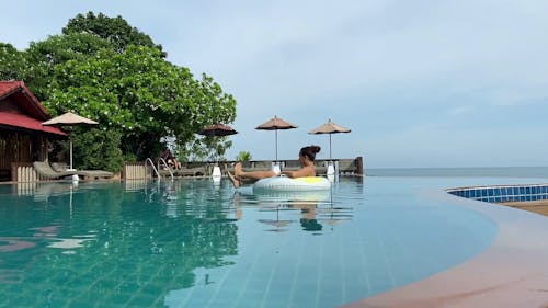 A Woman on Floater while in the Pool