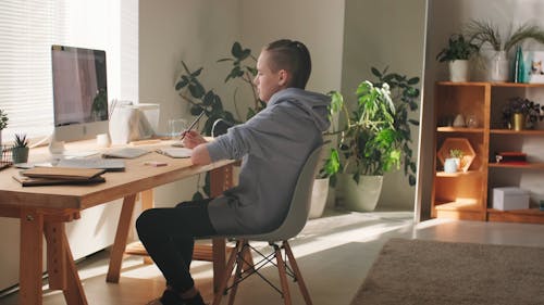 Boy Attending Online Class at Home