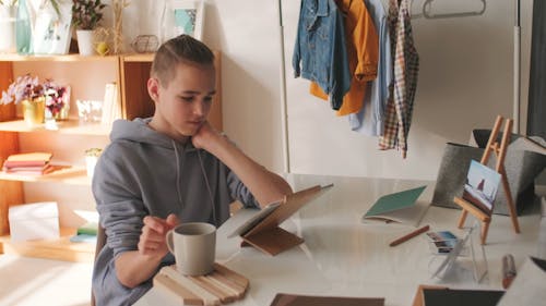 Boy Browsing on His Ipad