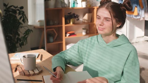 A Young Woman In Online Schooling While Staying At Home