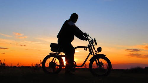 Silhouette Of Man Watching Sunset