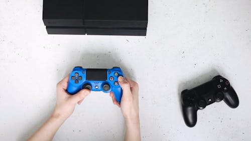 Person Using Blue Controller