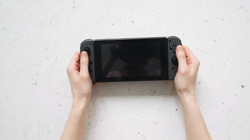 Person With Black Nintendo Switch