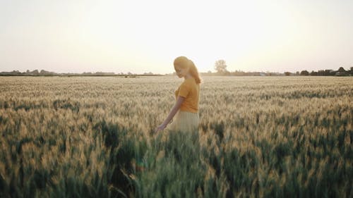 Girl Walking on The Grass