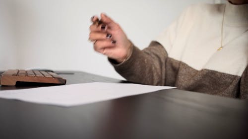 Woman Writing on White Paper