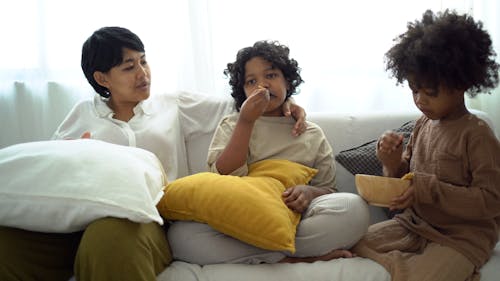 A Mother Talking to Her Kids while Sitting on the Couch