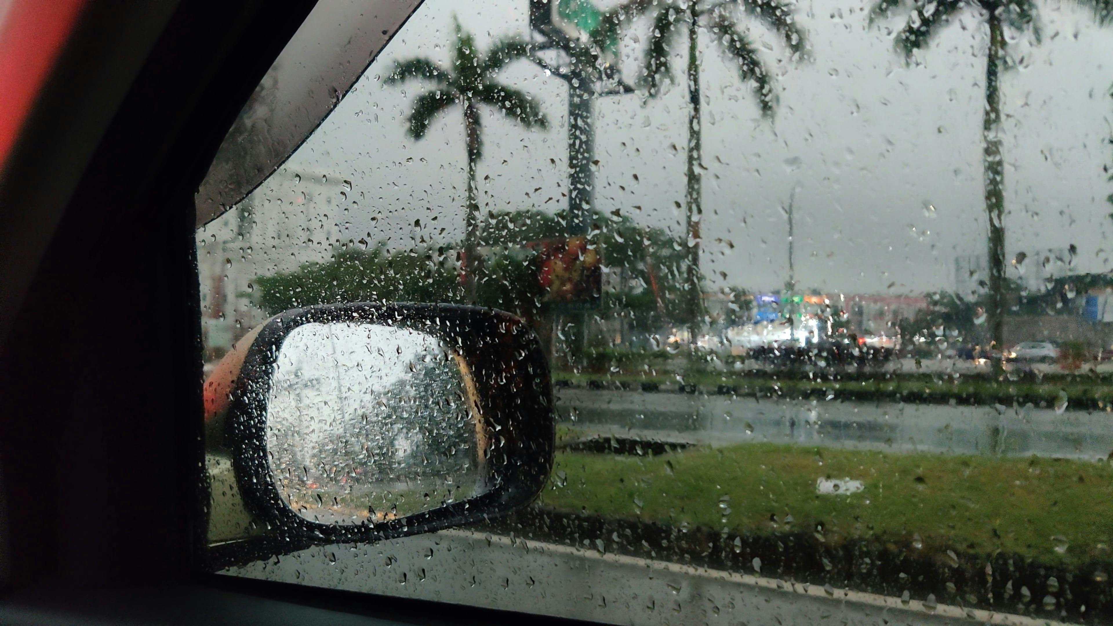 Woman looks out of a car window covered with rain, Stock video footage  33441