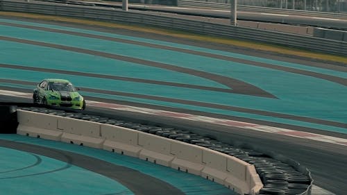 A Drifter Maneuvering The Race  Track
