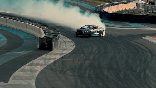 Close-up of a Race Car Drifting at a Race Track · Free Stock Photo