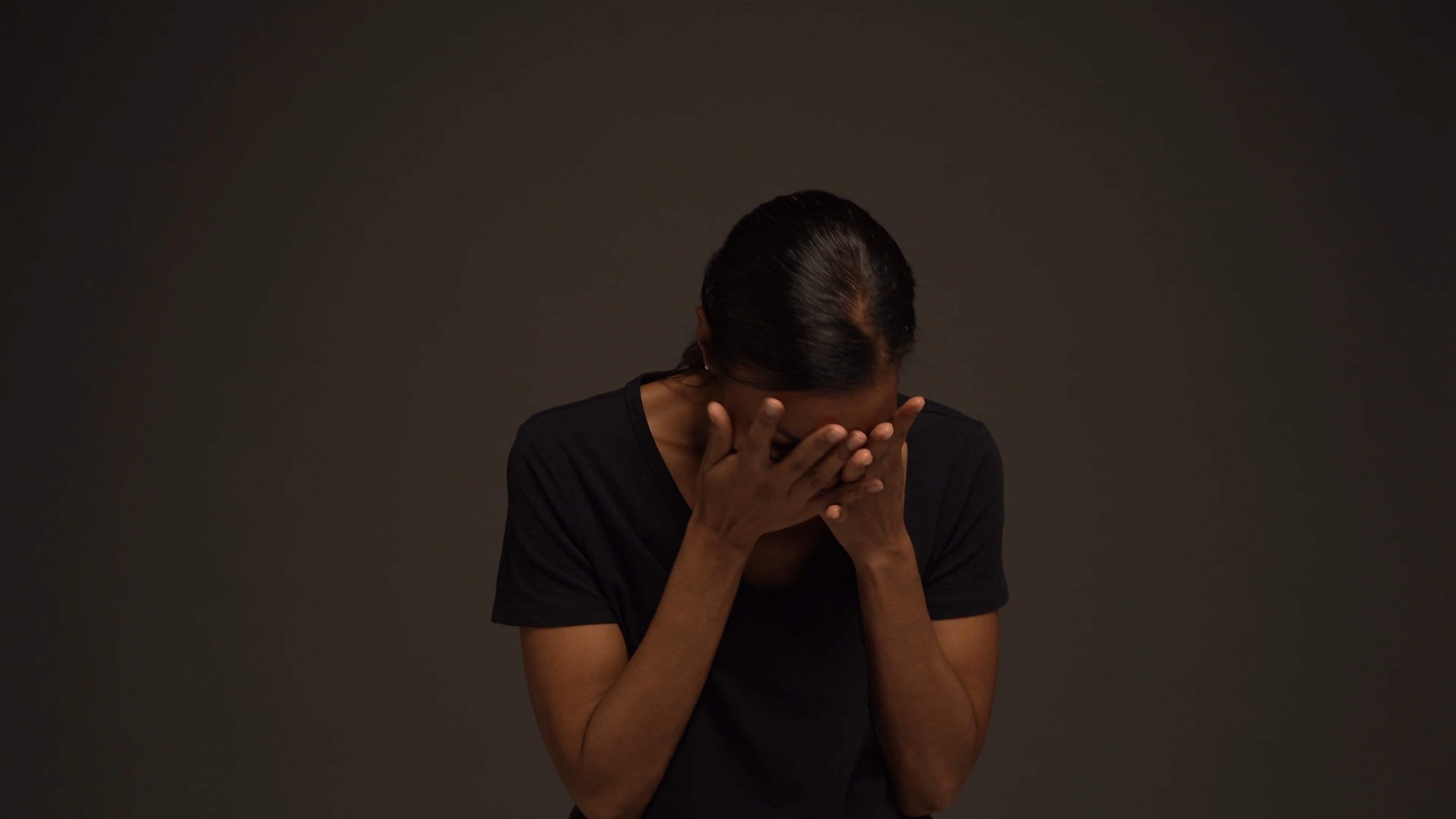 A Woman Crying And Covering Her Face Free Stock Video a-woman-crying-and-covering-her-face-free-stock-video
