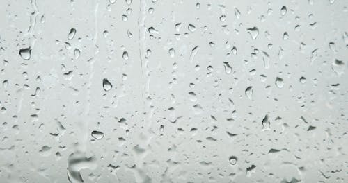 Close-up Video of a Water Droplets on Glass