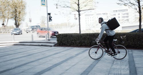 A Food Deliveryman Using A Bicycle To Make The Deliveries