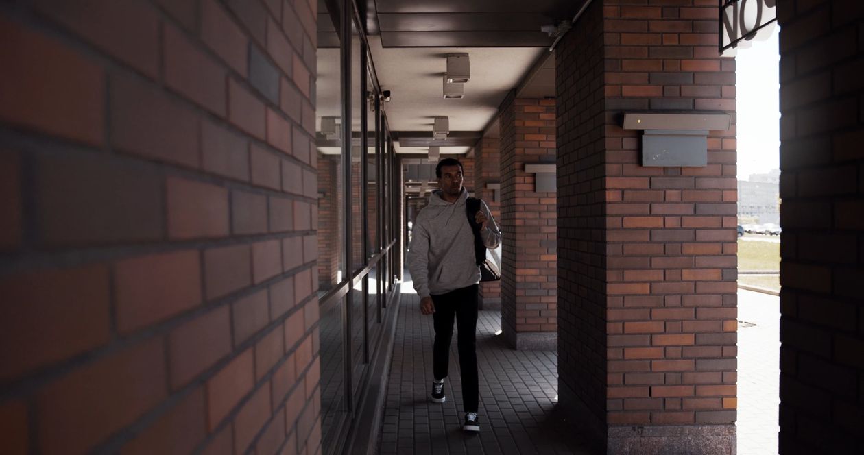 A person walking down a hallway in a building Free Stock Video Footage ...