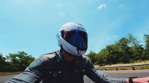 Man Wearing Helmet While Driving A Motorbike