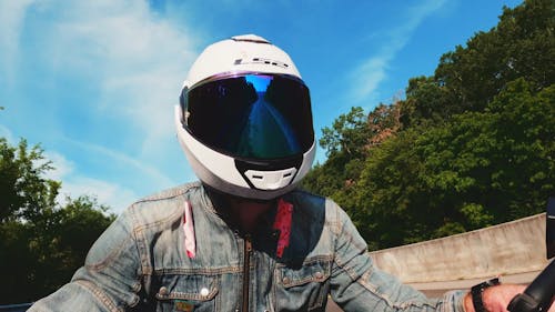 Man Wearing Helmet While Traveling On A Motorbike