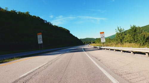 A Vehicle On The Road Traveling At High Speed