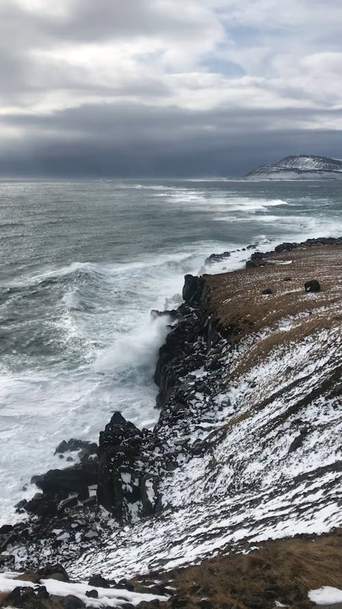 Waves Crashing On A Rocky Mountain