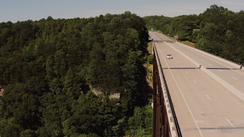 An Aerial Footage of Vehicles Crossing a Bridge